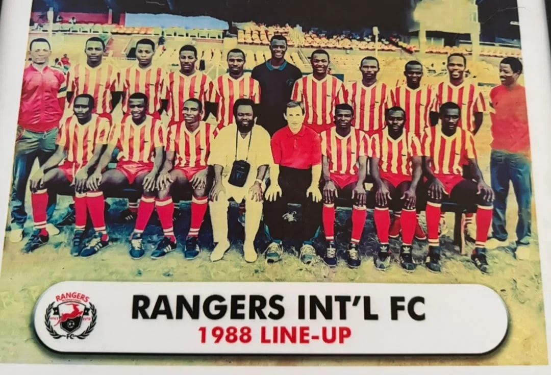 The 1988 Rangers squad in red and white striped shirts, seated and standing with officials.