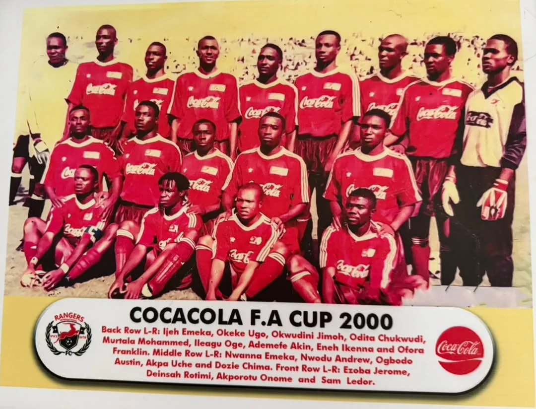 The 2000 Rangers cup side in red Coca-Cola shirts, in three rows.